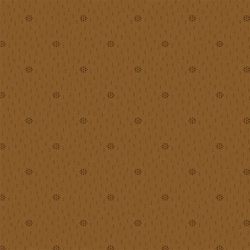 A fabric in a warm brown color with small, repeating dots and subtle lines.