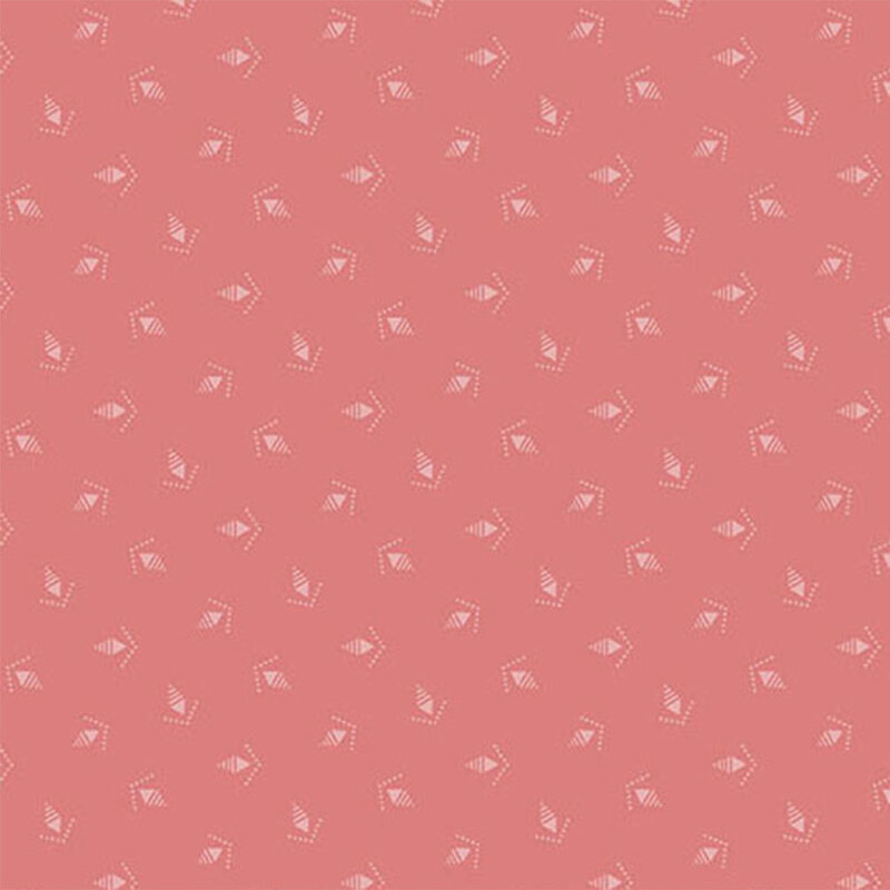 A rose pink fabric with tonal ditsy pinecones