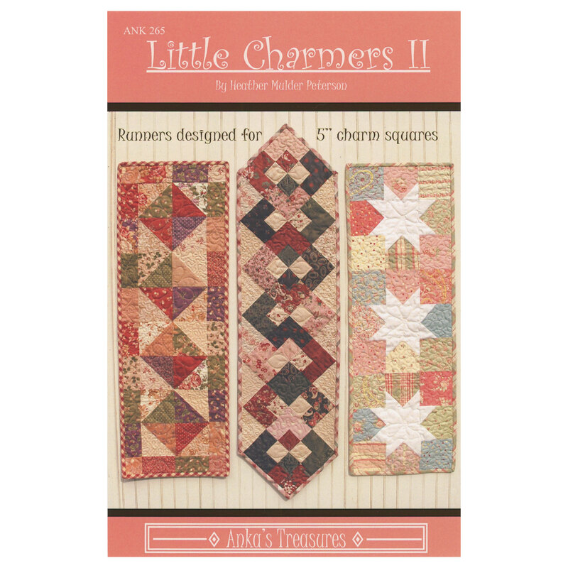 The front of the Little Charmers II pattern showing the finished table runners on a cream paneled background.