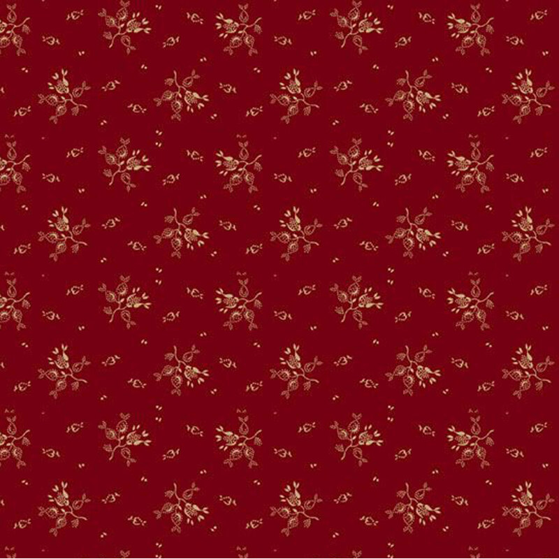 Red fabric with delicate floral motifs in gold