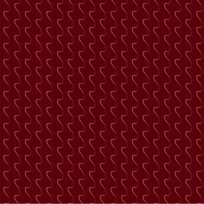 Red fabric with wavy gold lines forming a repeating pattern.