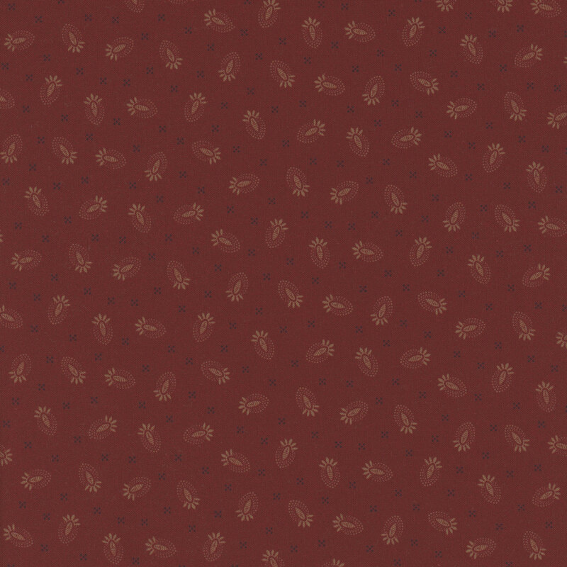 Red fabric with a repeated pattern of beige floral and leaf shapes.