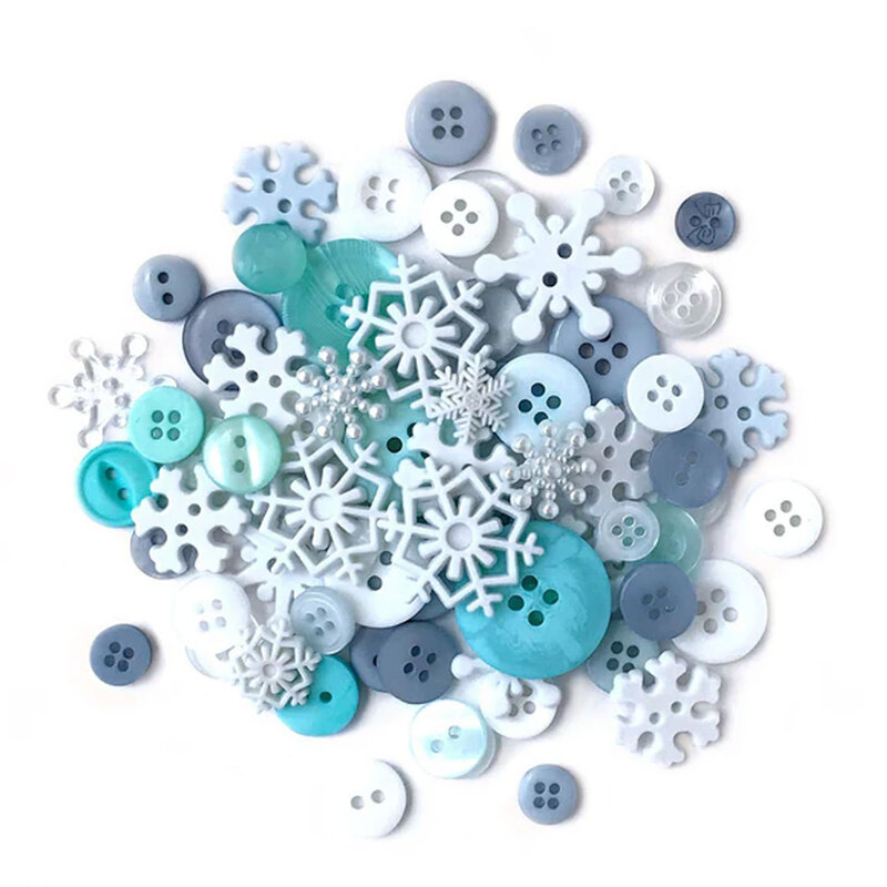 A pile of snowflake themed buttons in blue, teal, white, and gray colors.