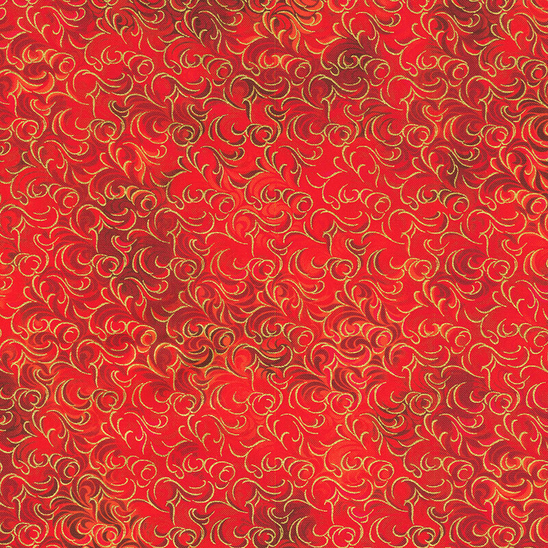 Red patterned fabric with swirling golden and orange designs on a vibrant background.