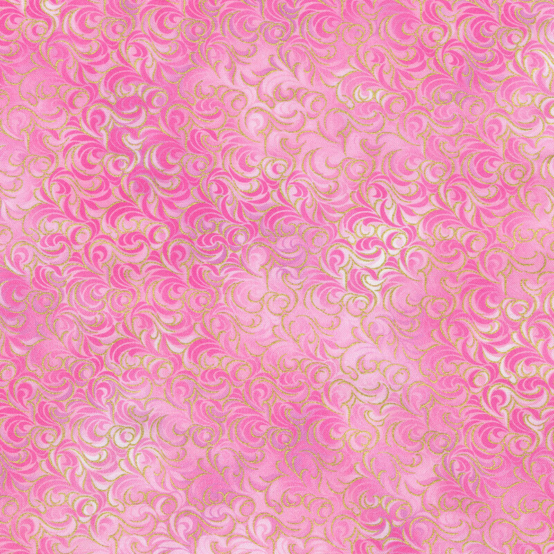 A textured pink fabric with intricate golden accent swirls.