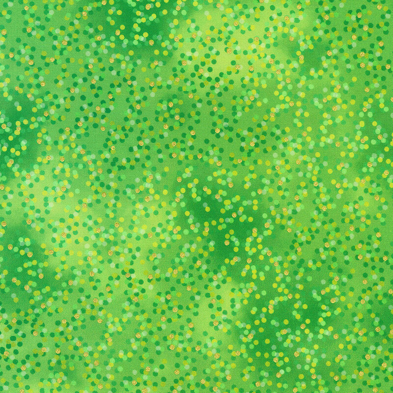 Mottled green fabric with green, yellow, and gold metallic polka dots scattered throughout