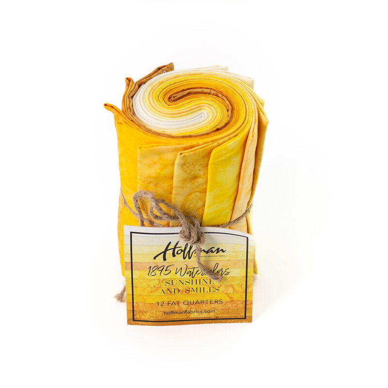 Rolled fabric bundle labeled Sunshine and Smiles, featuring 12 fat quarters in yellow and gold tones.