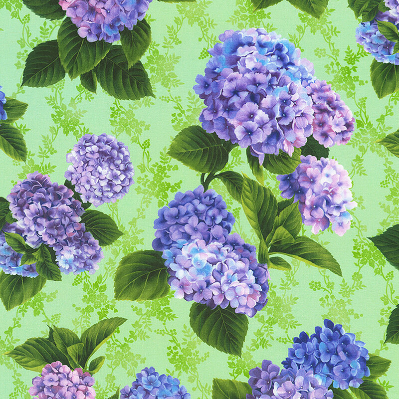 Light green fabric with tossed bouquets of large purple, pink, and blue hydrangeas with green leaves.