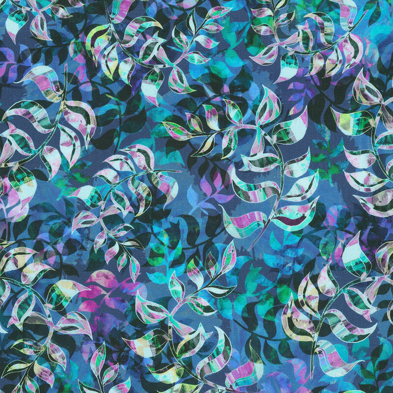 Fabric with colorful leaves in overlapping abstract patterns on a blue background.