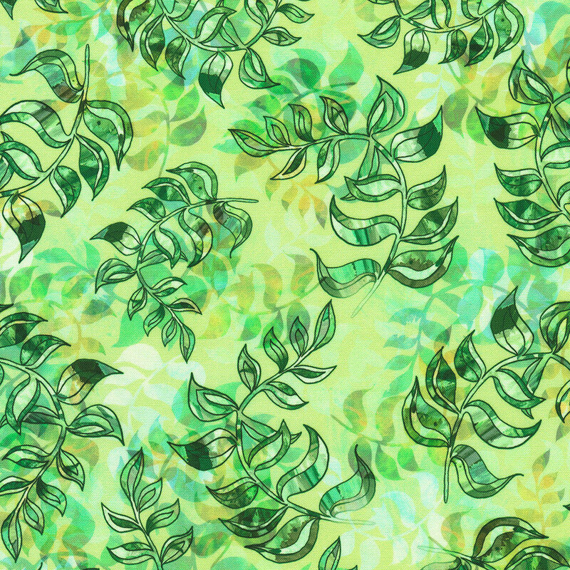 Fabric with colorful leaves in overlapping abstract patterns on a green background.