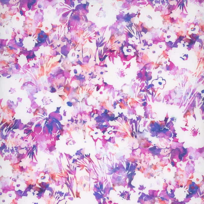 Fabric with a vibrant floral pattern featuring magenta, indigo, and white flowers on a bright purple background.