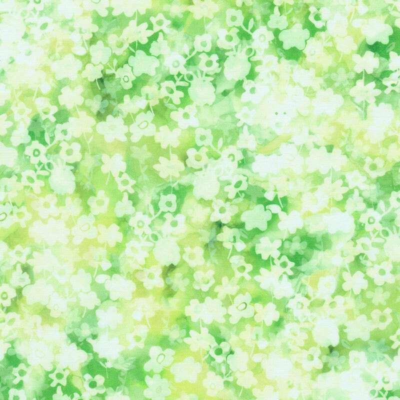 Fabric with a soft, abstract pattern of light yellow and green flowers on a watery background.