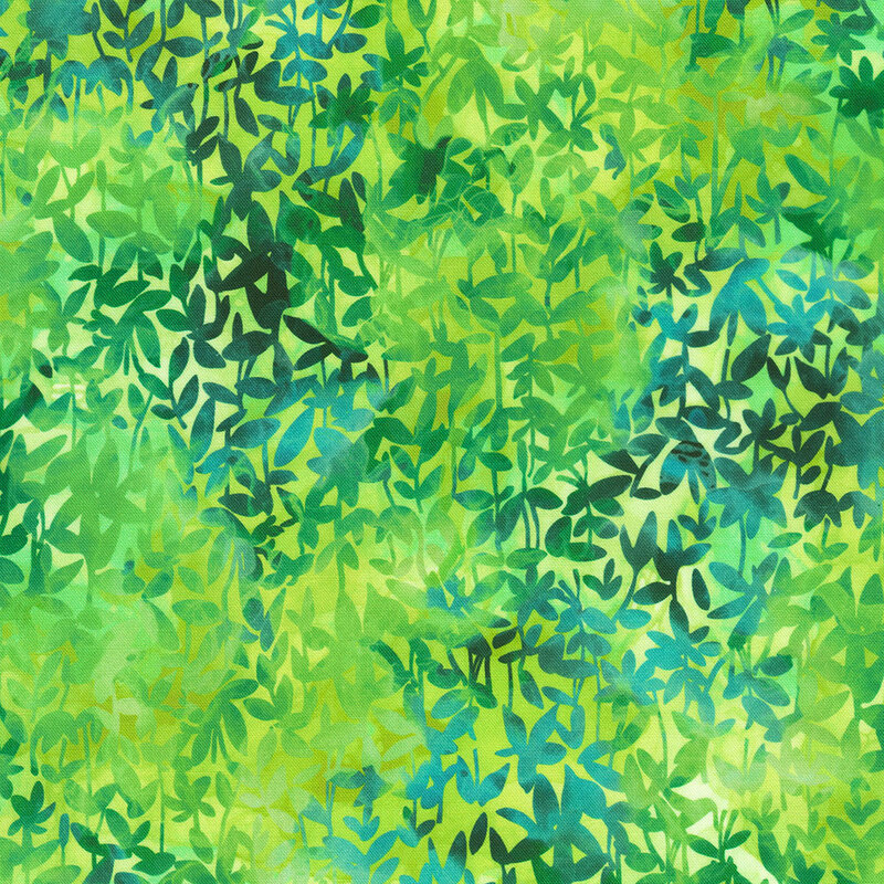 Fabric with a vibrant green background filled with overlapping leafy patterns in various shades of green and blue.