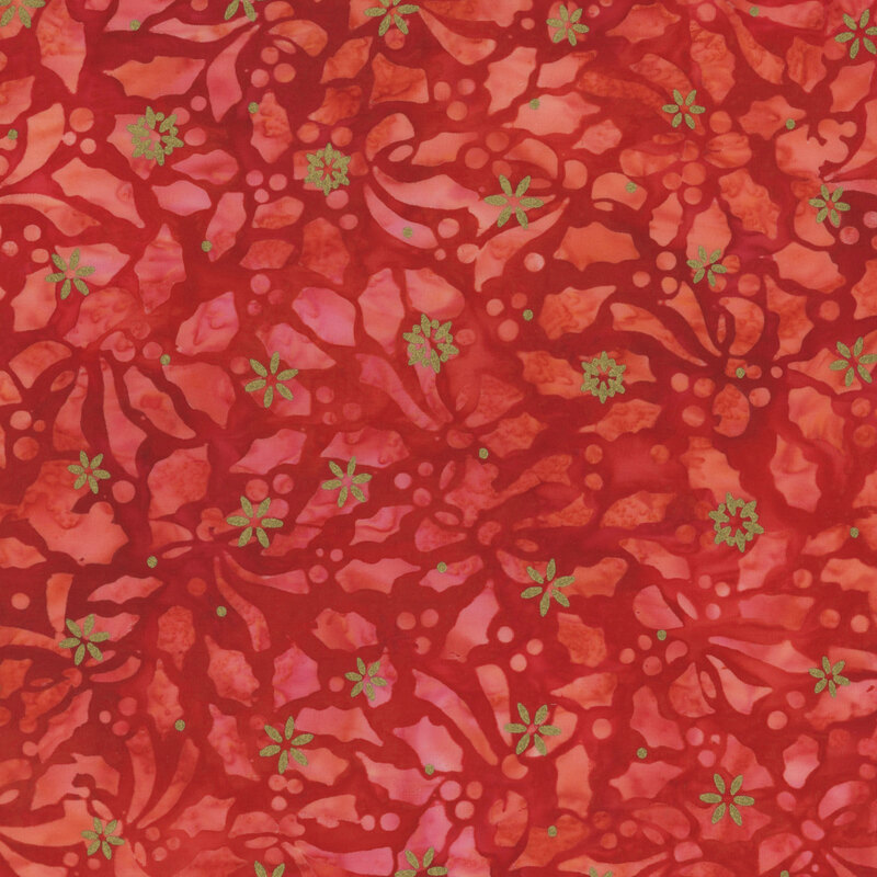 Mottled red fabric featuring a holly leaf design with gold metallic accents.