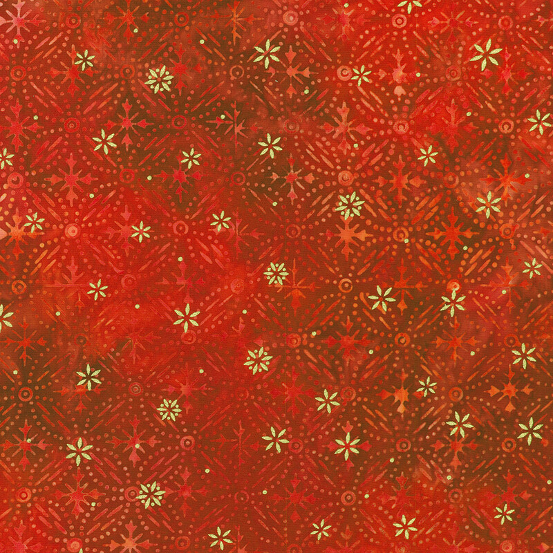 Red mottled fabric featuring a pattern of snowflake designs with gold metallic accents