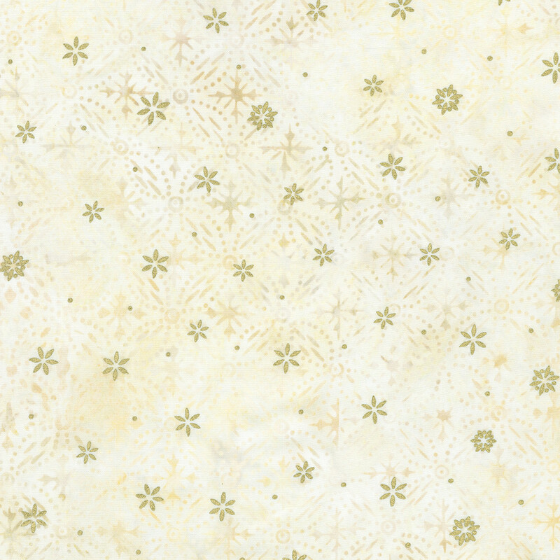 Cream mottled fabric featuring a pattern of snowflake designs with gold metallic accents