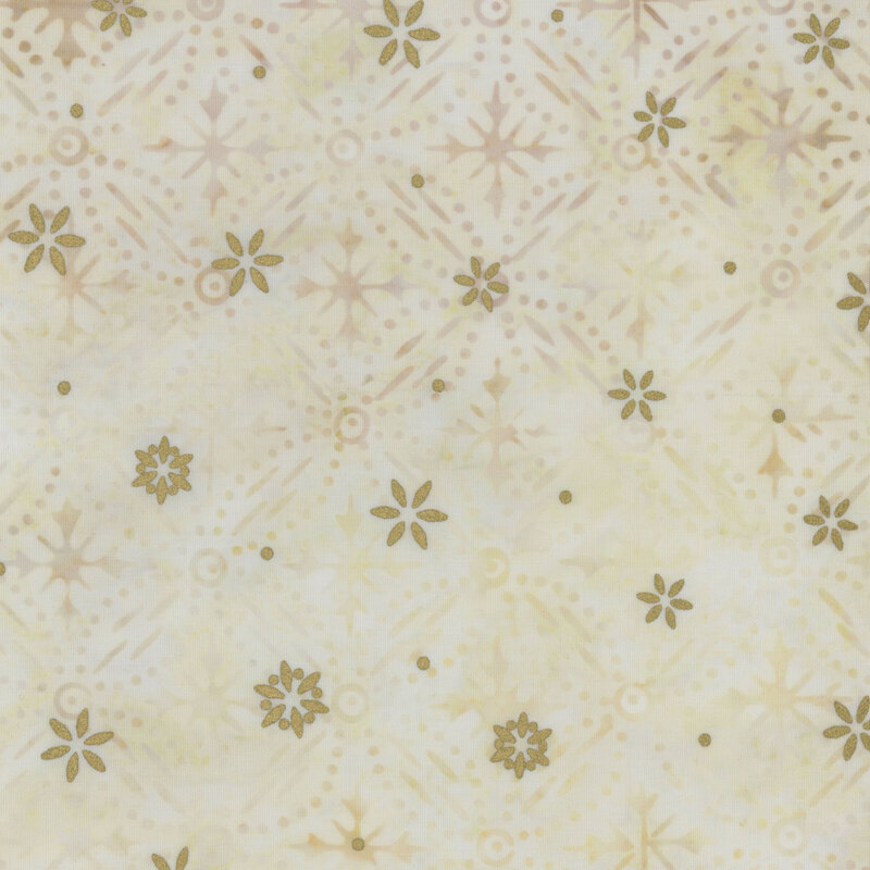 Cream mottled fabric featuring a pattern of snowflake designs with gold metallic accents