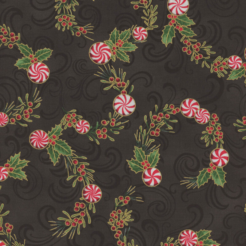 Pattern of red and white peppermint candies entwined with green holly leaves on a black background.