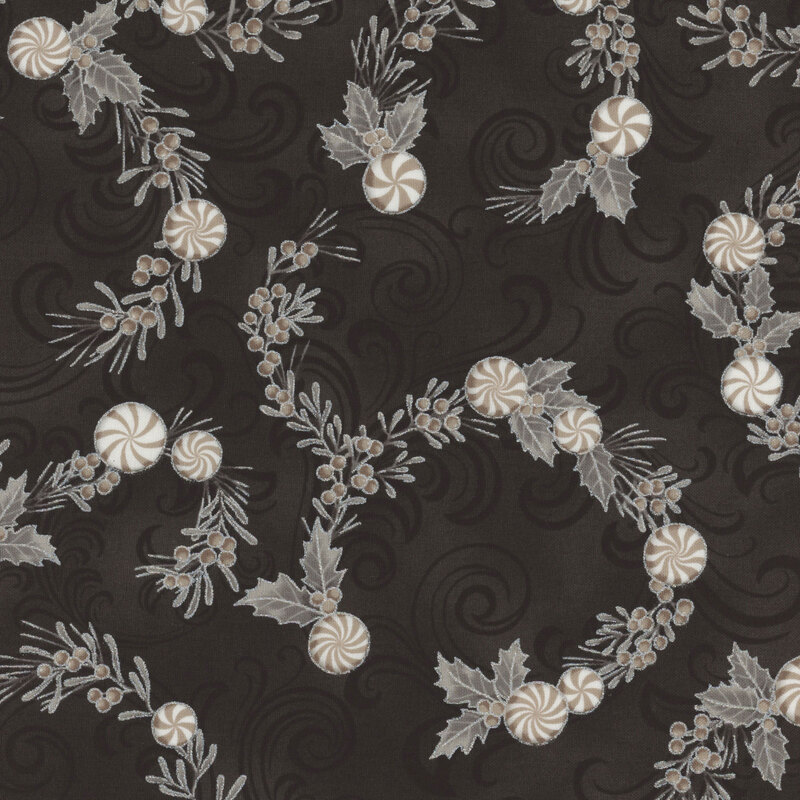 Patterned fabric featuring swirling dark background with holly leaves, berries, and striped peppermint candies.