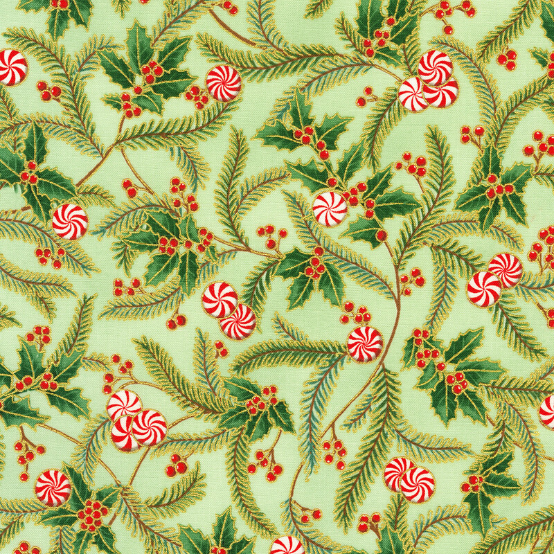 A green fabric pattern with holly leaves, red berries, and peppermint swirls.