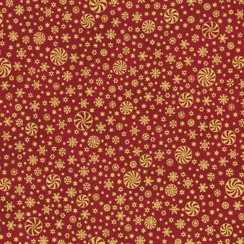 A red fabric with a pattern of golden peppermints and stars.