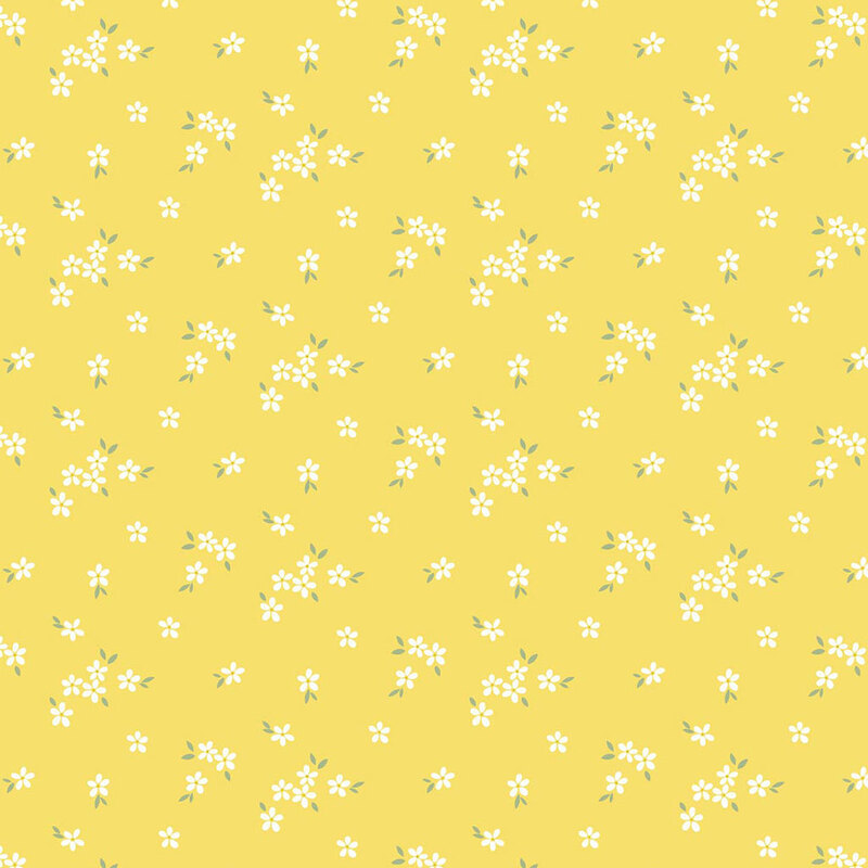 Yellow background with scattered small white flowers and green leaves.