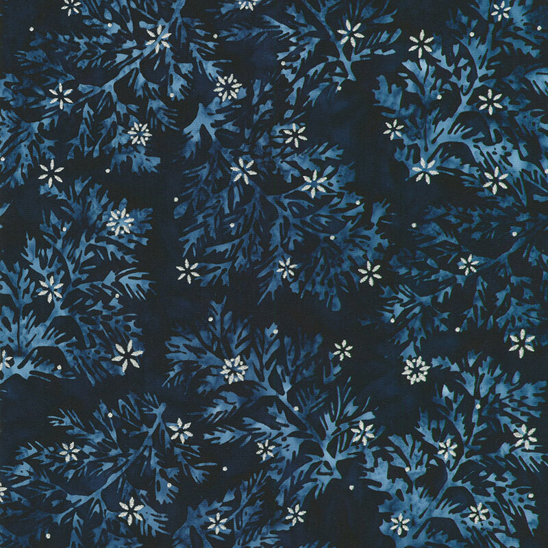 Dark navy batik fabric with intricate leaves and small silver metallic stars scattered throughout.