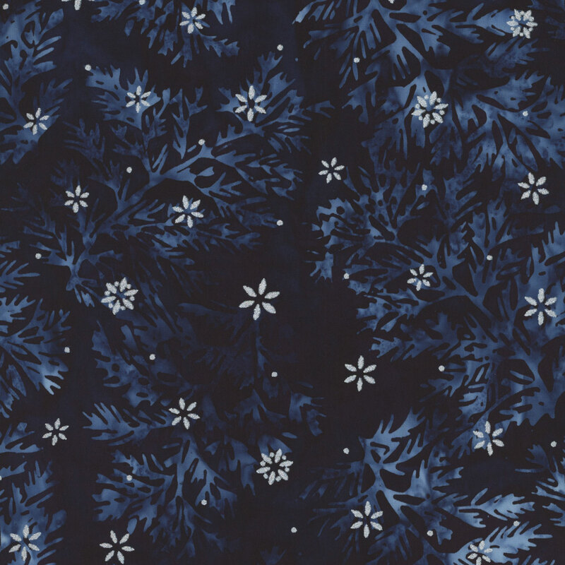 Dark navy batik fabric with intricate leaves and small silver metallic stars scattered throughout.