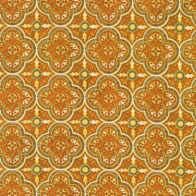 Geometric fabric pattern featuring golden, orange, and green leaves in a repeating design.