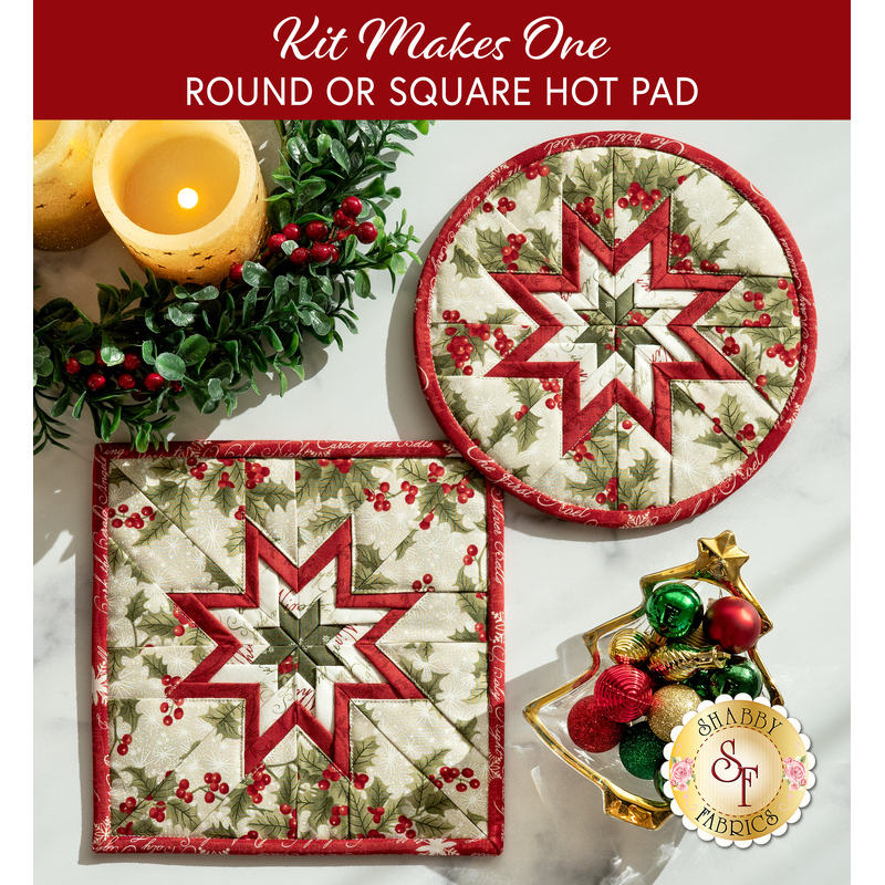 Two completed versions of the cream Folded Star Hot Pads, staged on a white striated countertop with coordinating decor like garlands, candles, and ornaments.