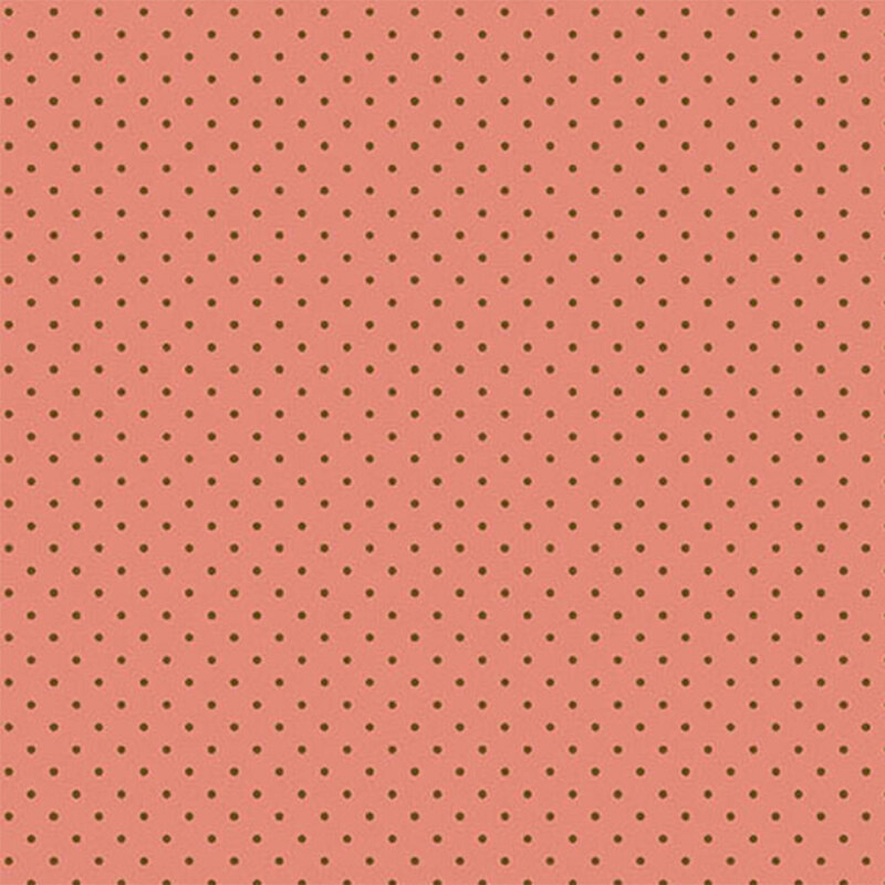 Coral fabric with evenly spaced small brown polka dots.