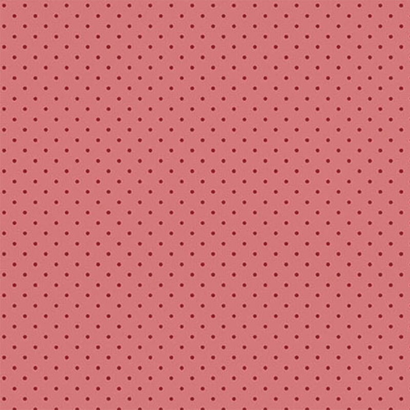 Pink fabric with evenly spaced, small dark red polka dots.