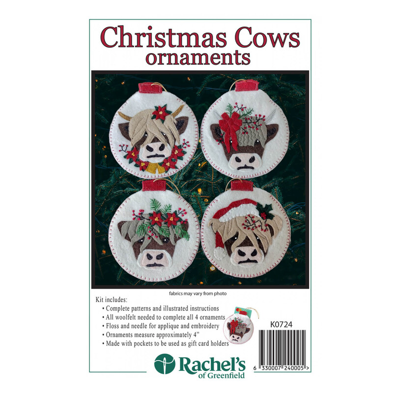 Front of the kit, showing the four completed cow ornaments staged in front of a lit Christmas tree.