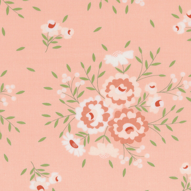 A soft pink fabric featuring scattered floral patterns in white and shades of red and green.