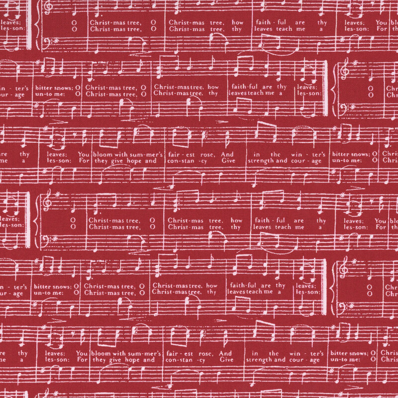 Red fabric with a pattern of white sheet music featuring the lyrics of O Christmas Tree.