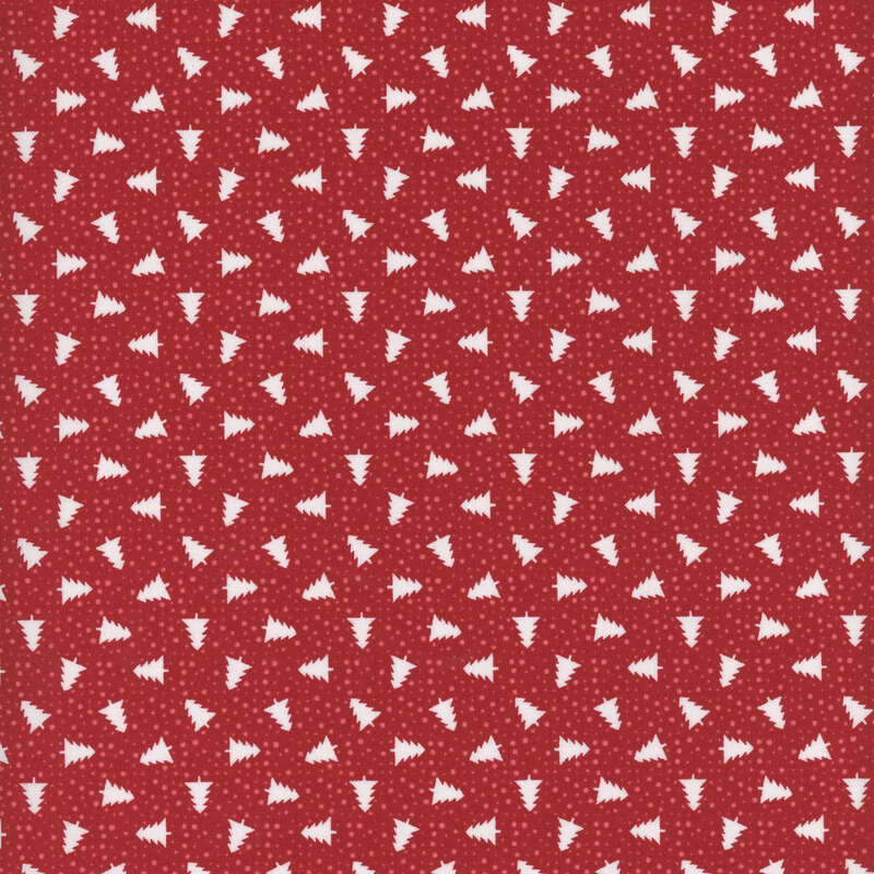 Red fabric with tossed white pine trees and scattered tonal dots.