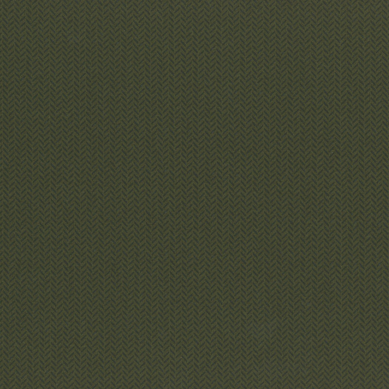 Dark green fabric with alternating herringbone pattern in tonal green.