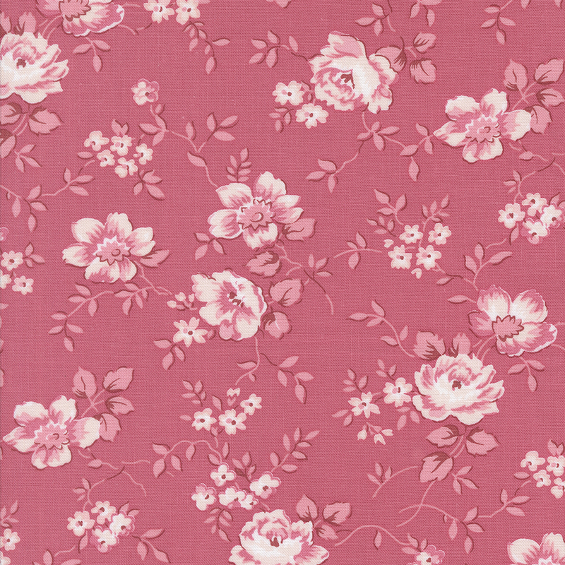 A pink floral fabric pattern featuring large, pale pink roses and small blossoms.