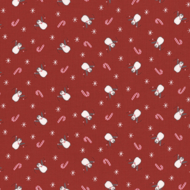 Red fabric pattern featuring white penguins, pink candy canes, and small stars.