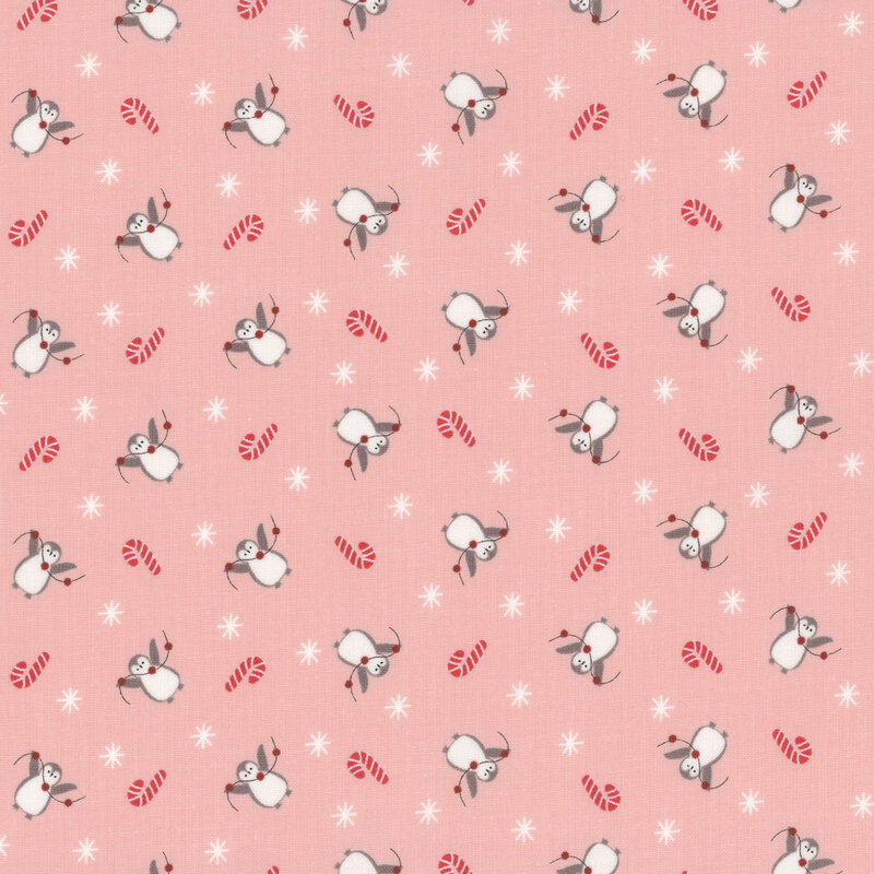 Patterned fabric with penguins, red candy canes, and white snowflakes on a pink background.