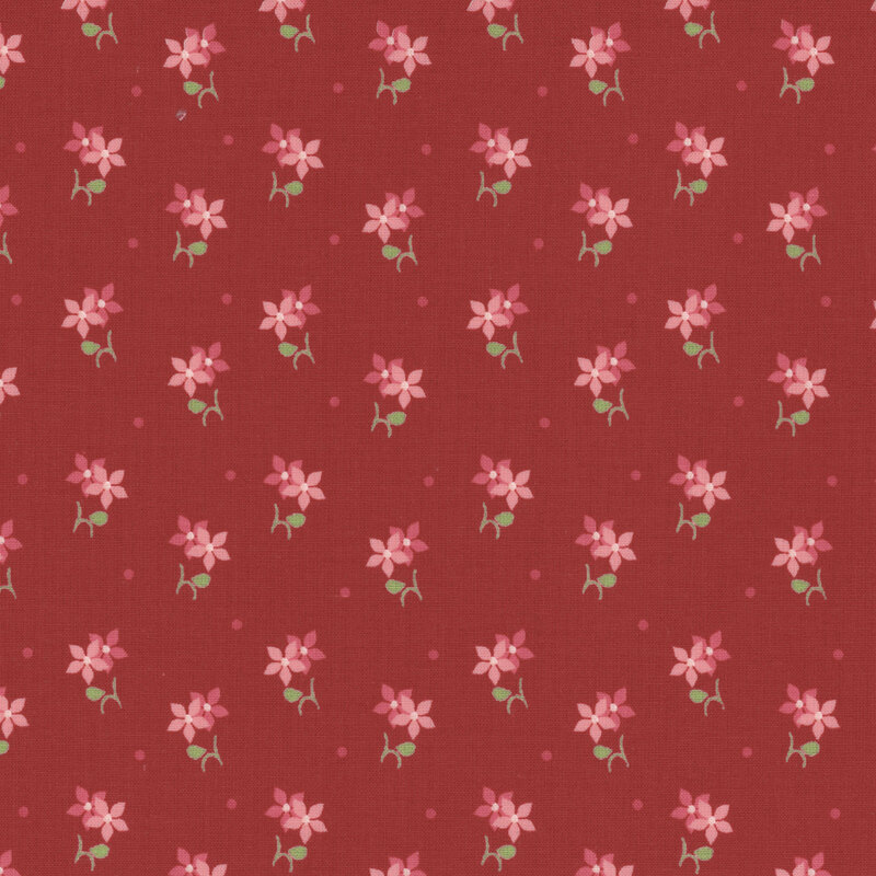 Fabric with pink and burgundy florals with green stems against a dark red background