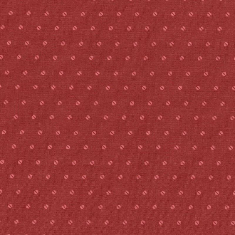 Red fabric with a subtle pattern of small, evenly spaced light red dots.