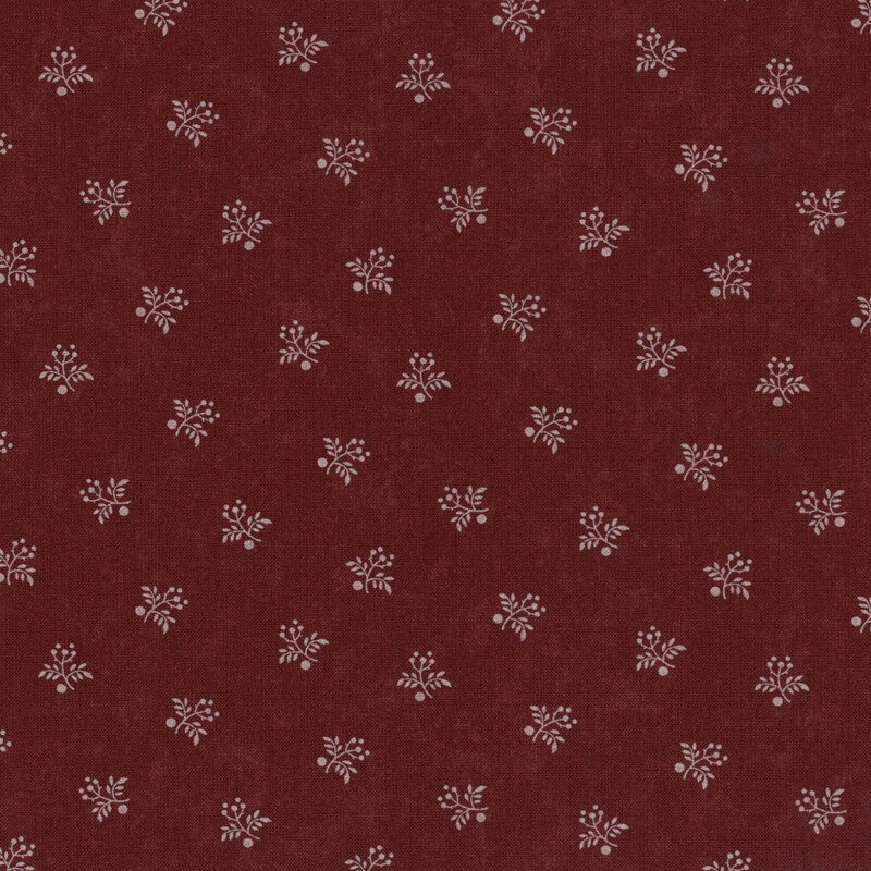 Brown fabric with a repeating pattern of small white floral designs.