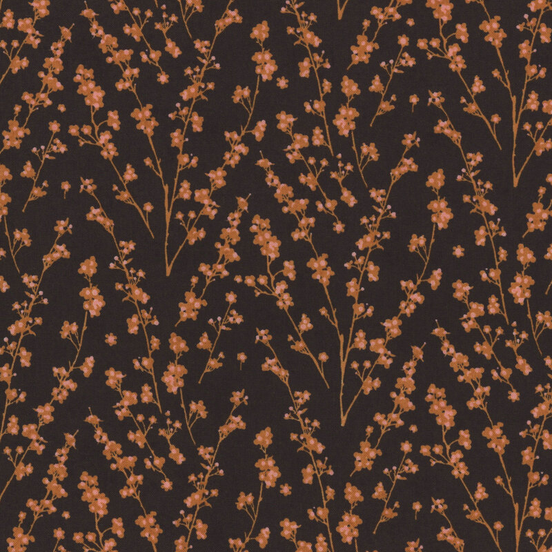 Dark brown fabric covered with delicate branches and orange flowers, creating a floral pattern.