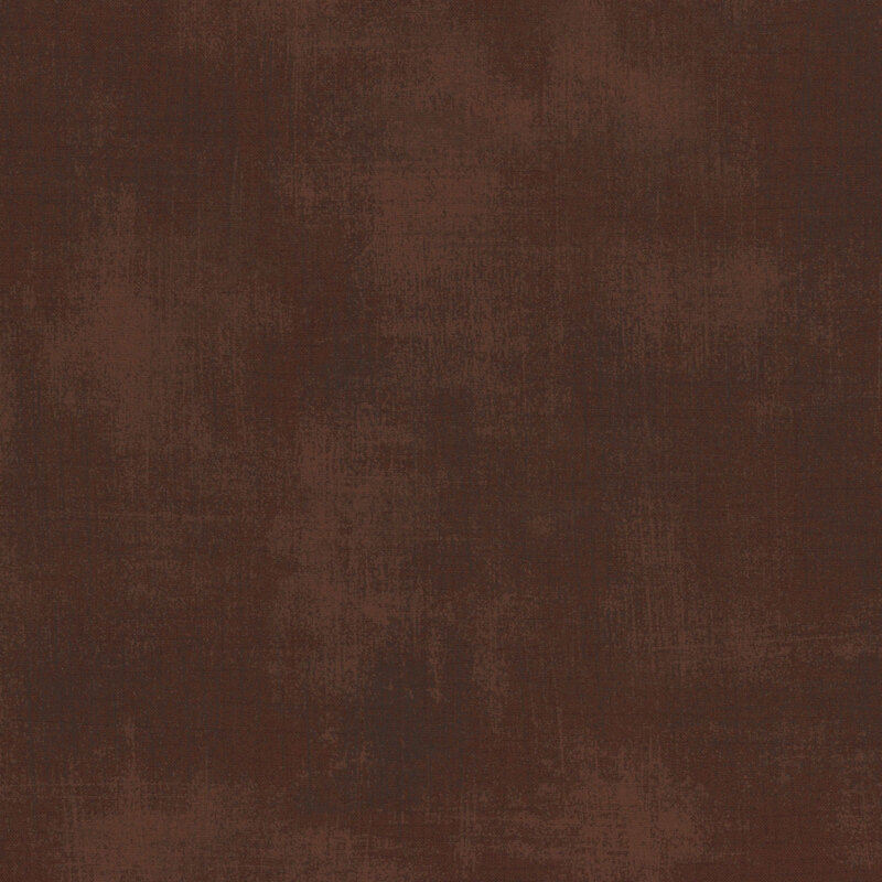 Brown mottled and grungy-textured fabric.