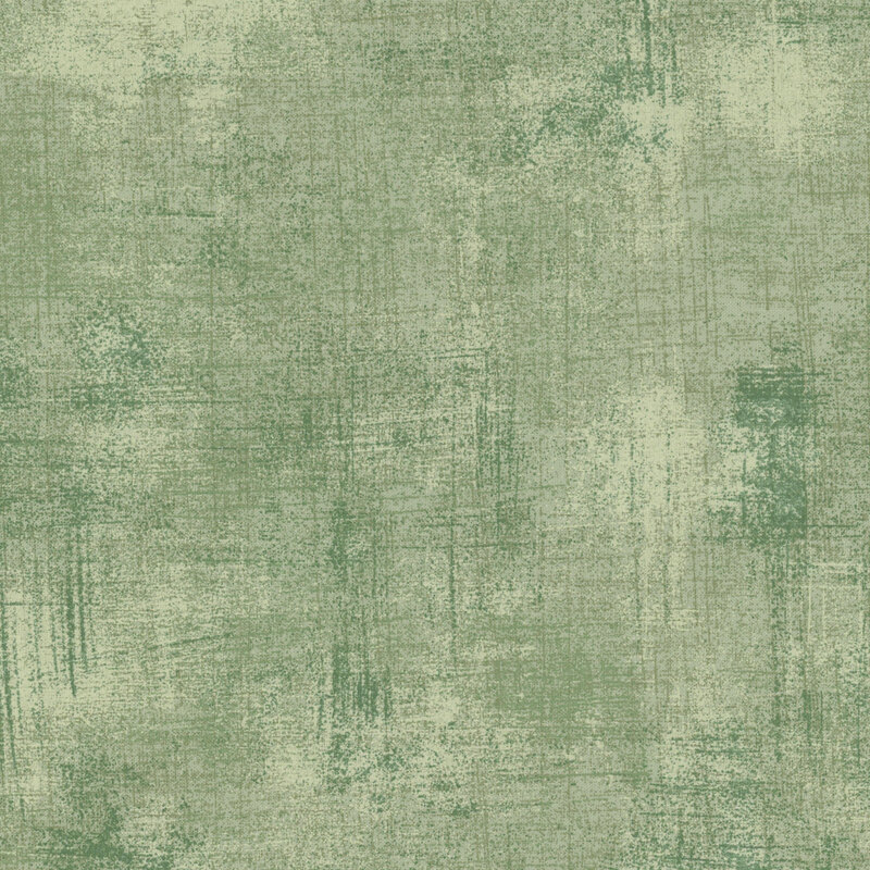 Light green mottled and grungy-textured fabric.