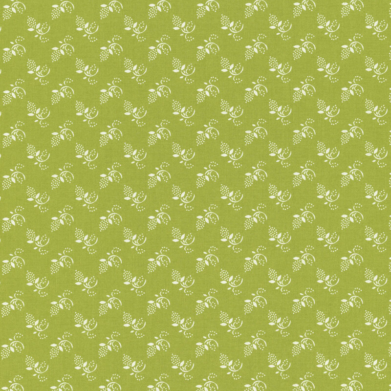 Light green fabric with tossed tonal sprigs and dotted buds.