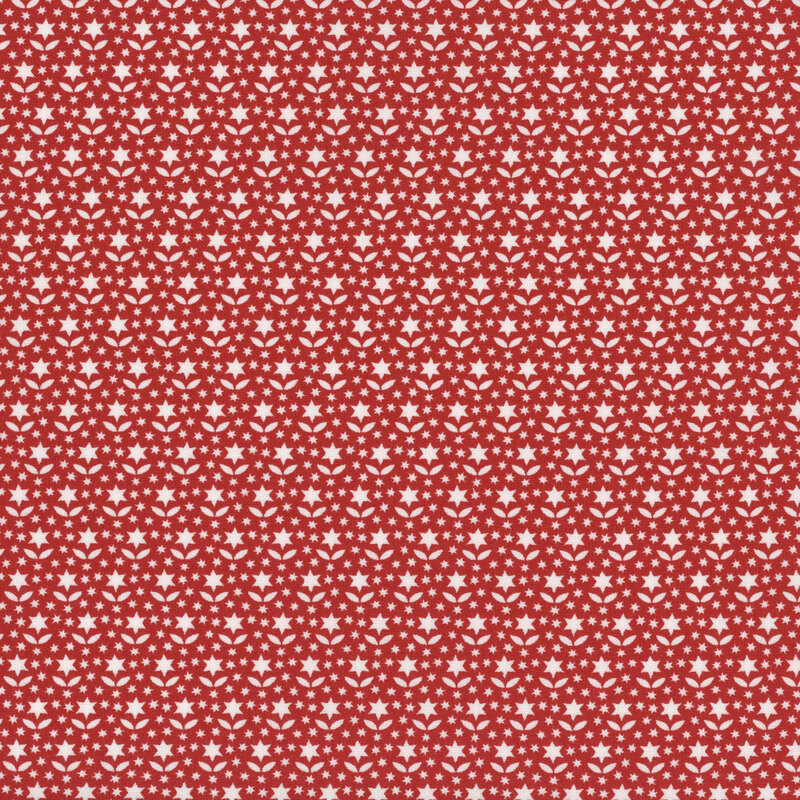 Red fabric with rows of white star-shaped flowers and leaves among scattered dots.