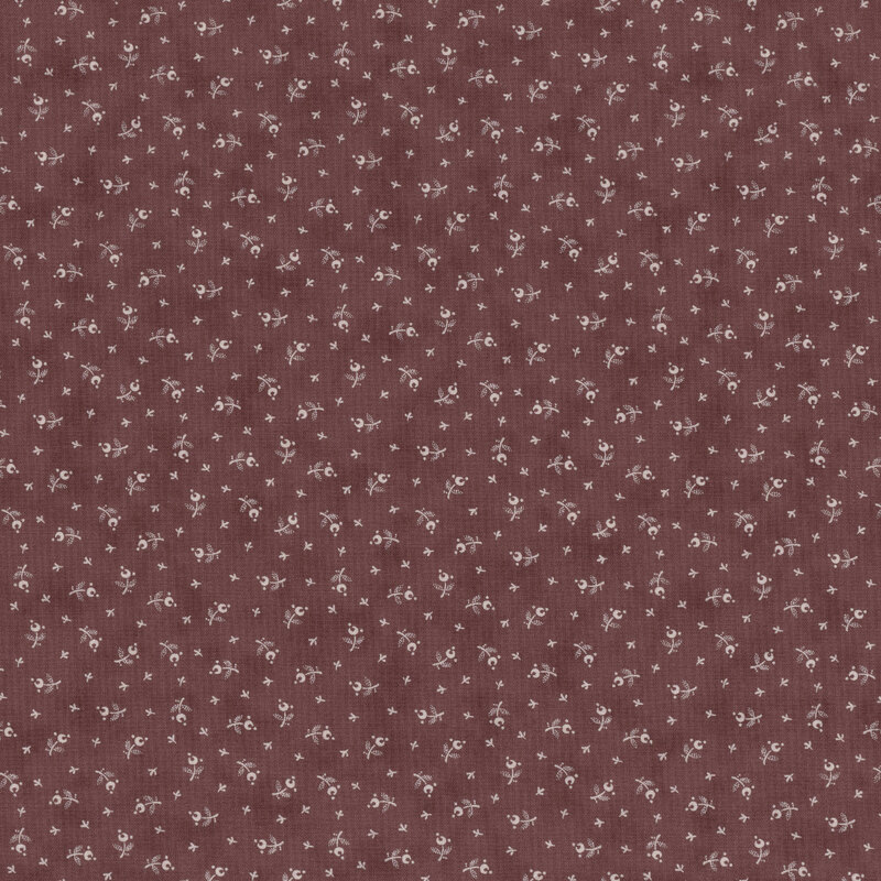 Brownish purple fabric featuring a pattern of small floral motifs