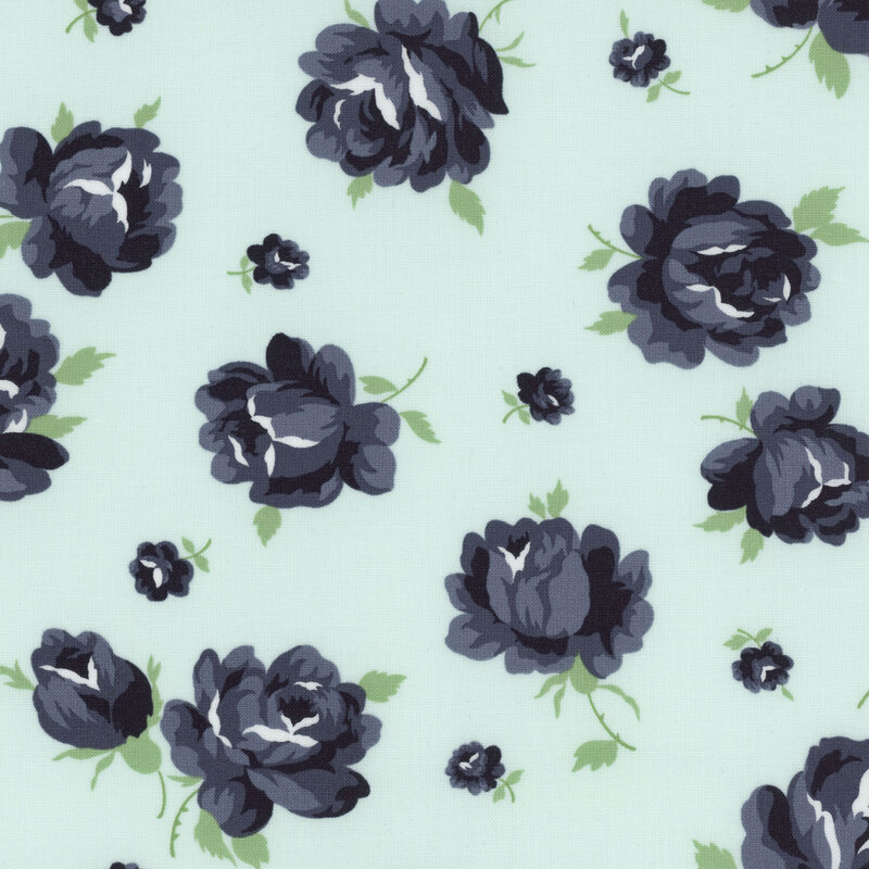 Fabric featuring large navy blue roses with smaller buds on a light aqua background.